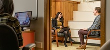 A meeting in progress at the psychological services center between a faculty member and student.