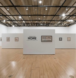 An empty John A. Day Gallery with art on the walls.