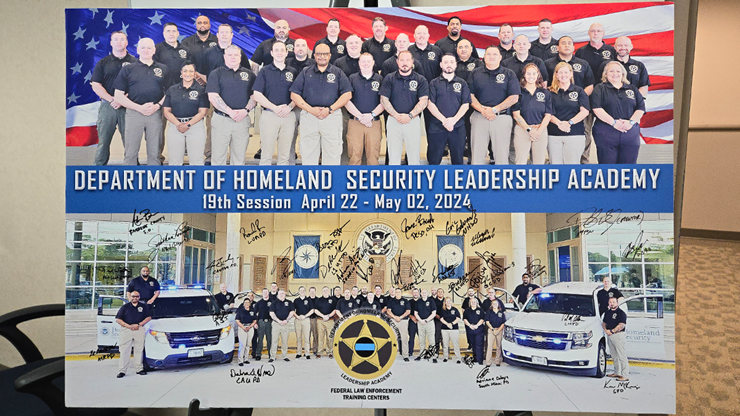 A posterboard with photos of the DHSLA 19th cohort and signatures of all the officers involved.