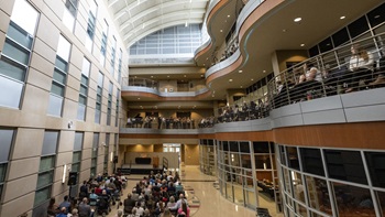The inside of the Lee Medical building with a crowd sitting on chairs
