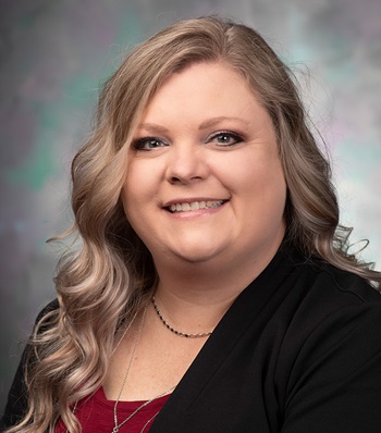 Success story Ashley Herrity smiling.