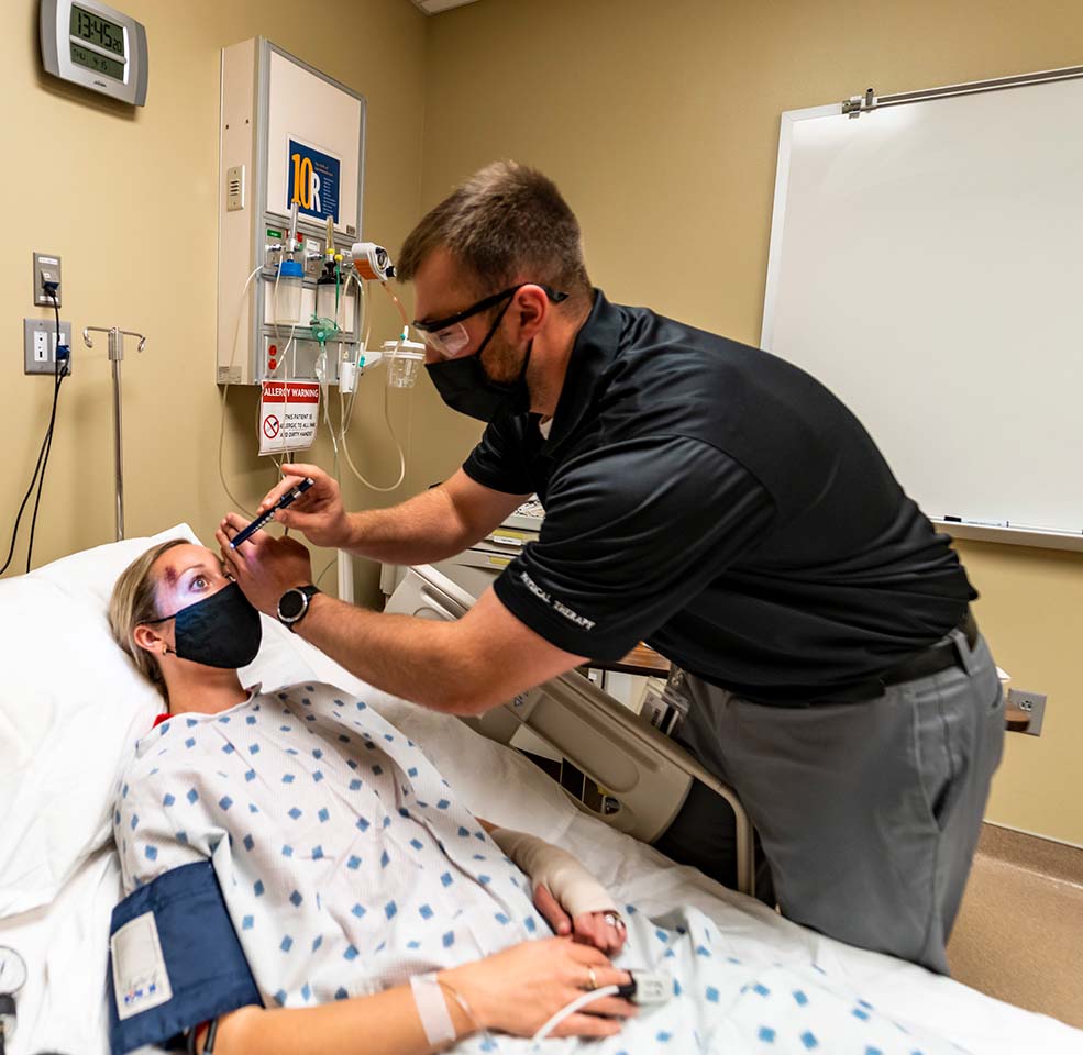 male USD student checking on patient