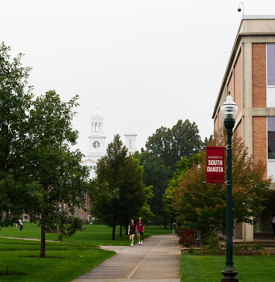 Picture of campus with old main in the horizon