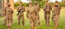 Group of ROTC Cadets Talking in a Circle.