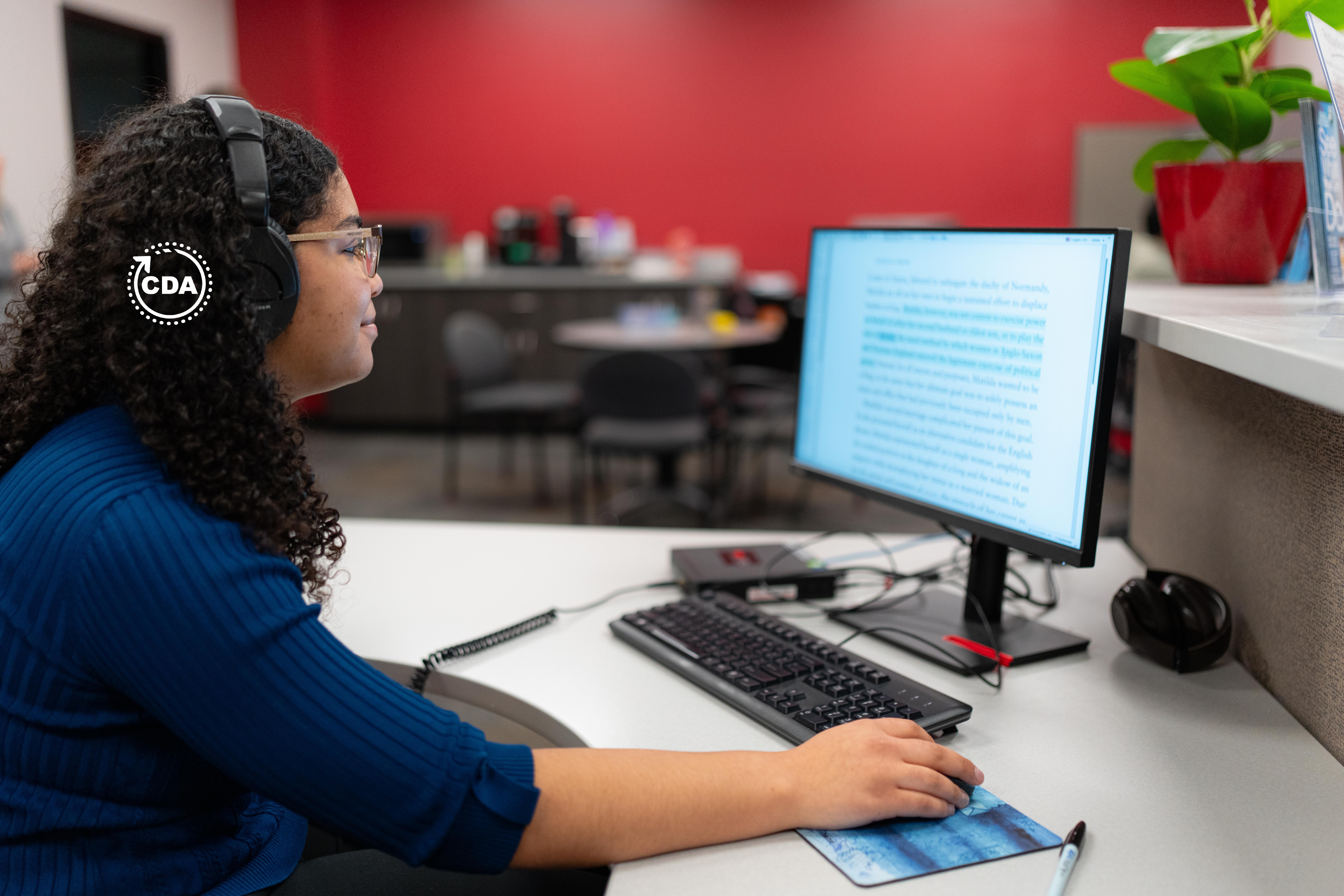 Accessibility work being done by a woman in a desk