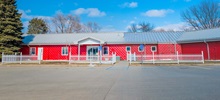 Exterior photo of the red Vucurevich Children's Center building