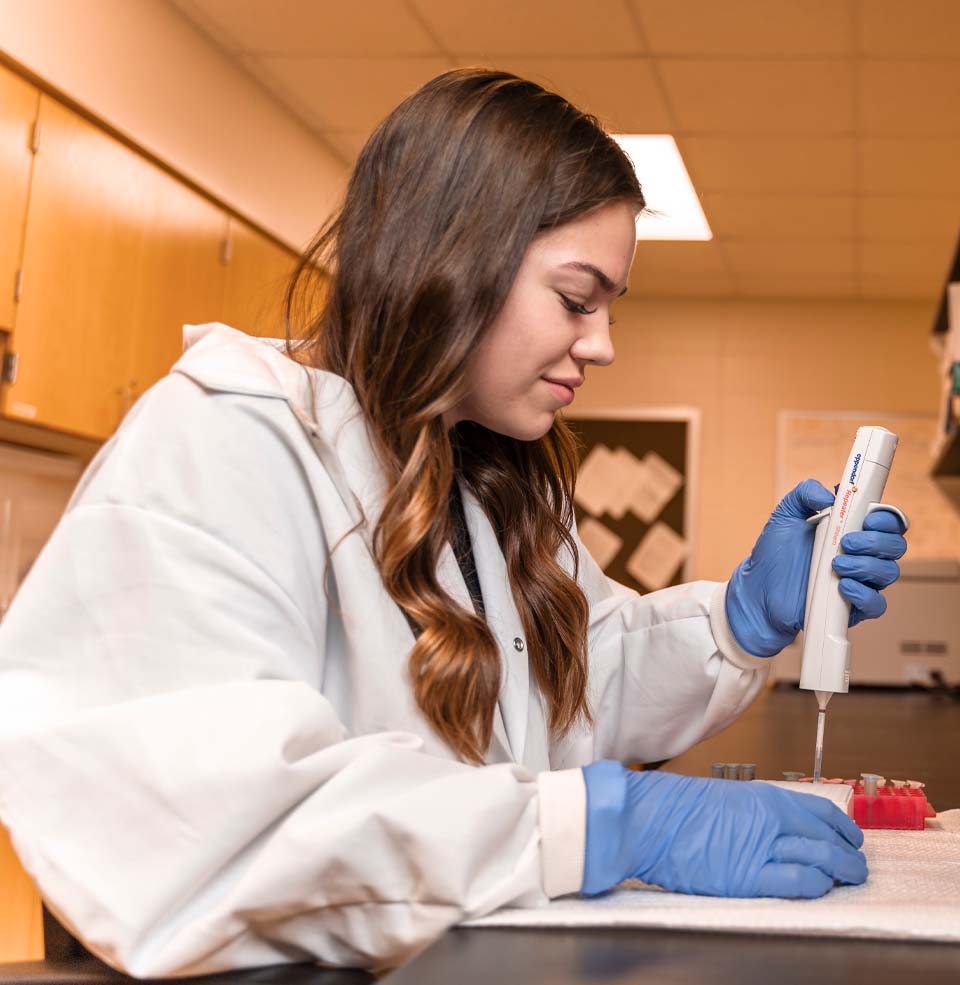 A student conducting research in a lab.