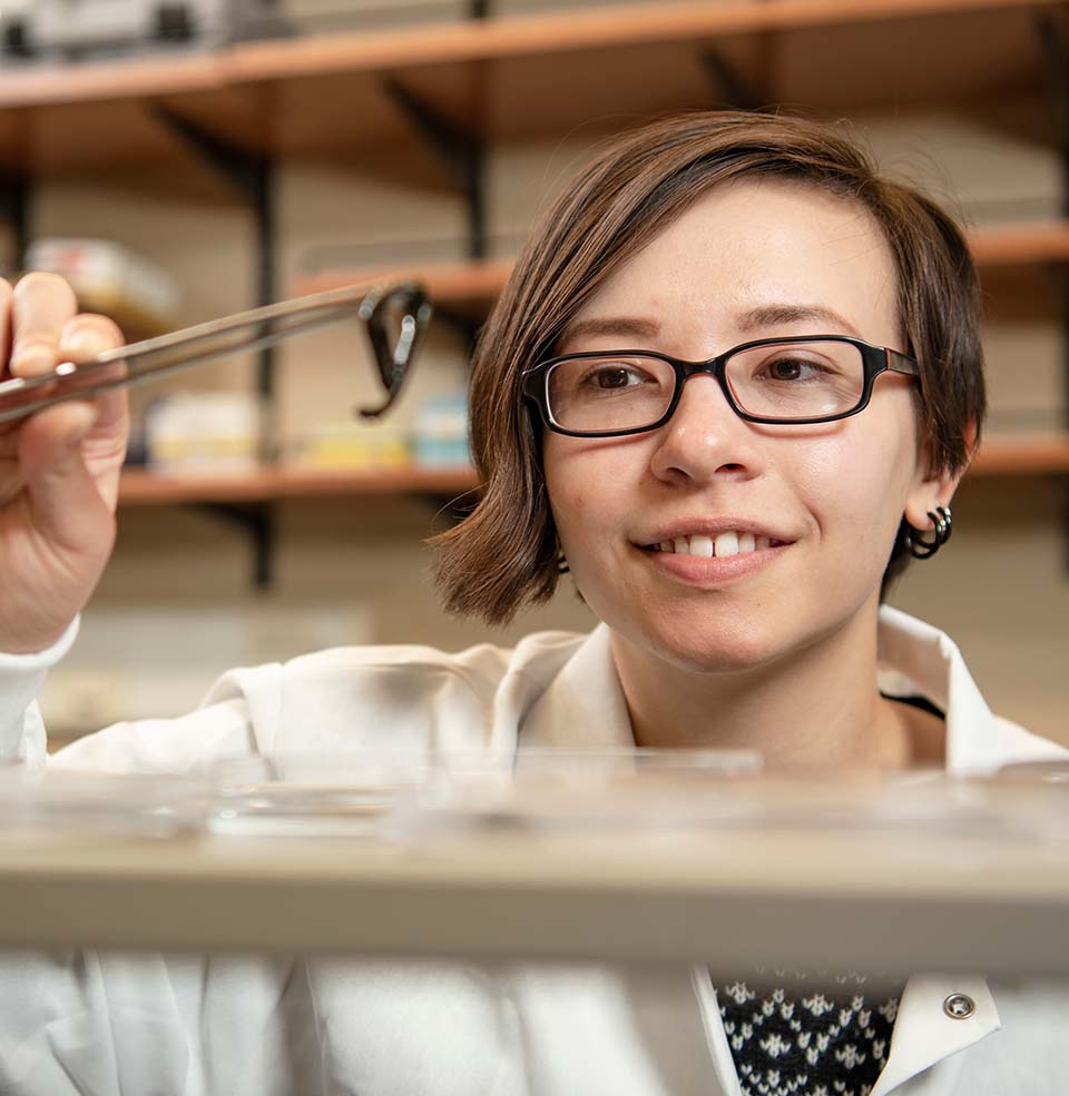 Student Danielle Brown analyzing research work.