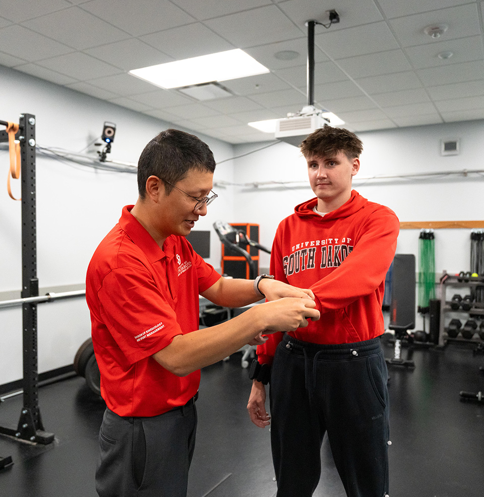Student and teacher in lab about the theory of movement