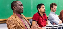 Educational leadership students paying attention in a classroom.