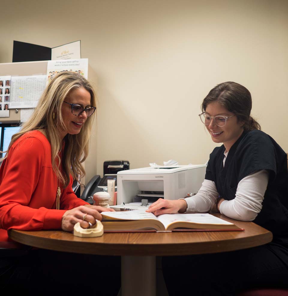 Faculty Member Mentoring a Dental Hygiene Student
