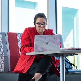 A Health sciences student working on her laptop.