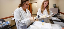 Medical Laboratory Student and Professor Examining Test Results.