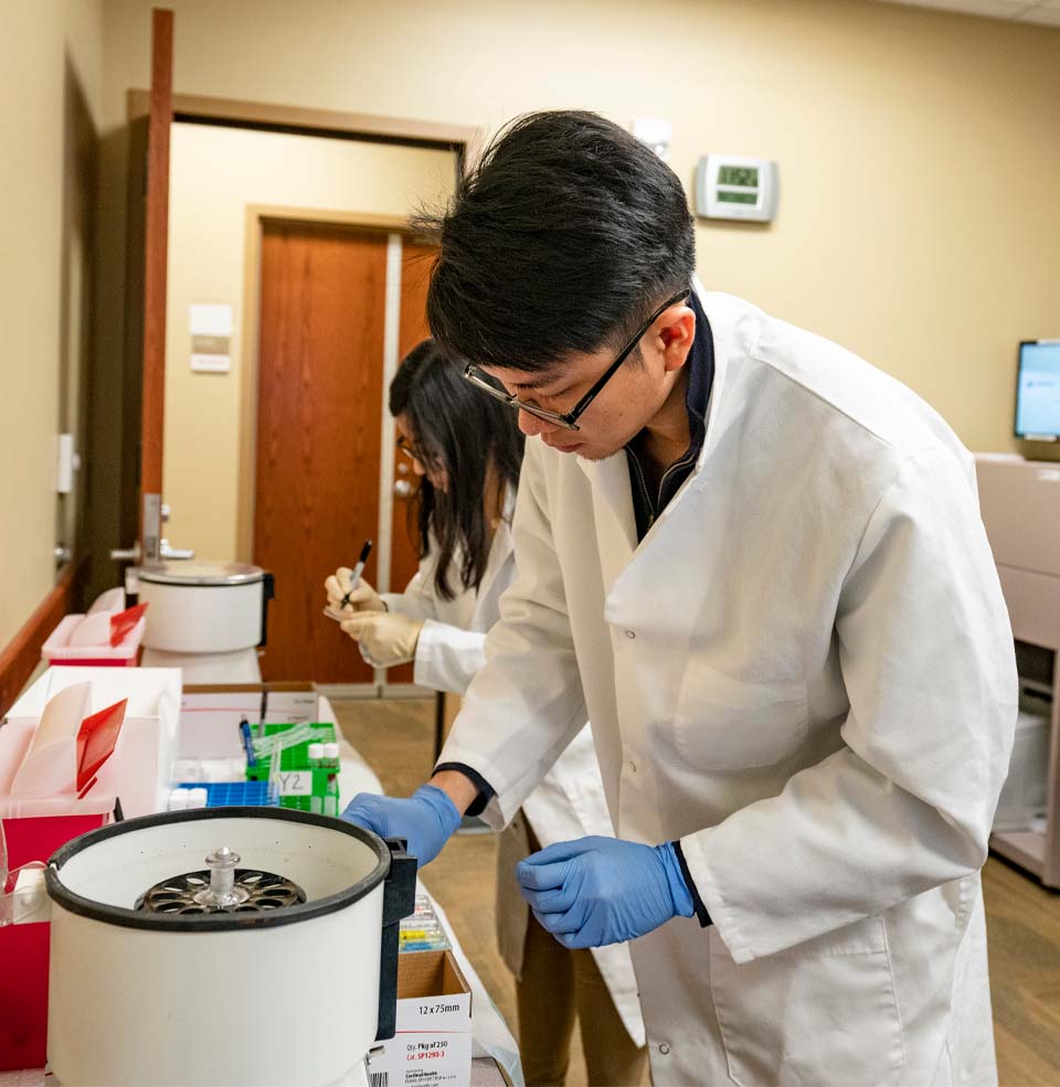 Nursing students conducting lab research.