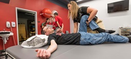 USD Physical Therapy student stretching out a a patient