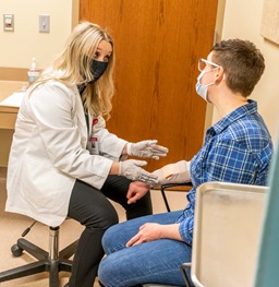 Practitioner Helping a Patient