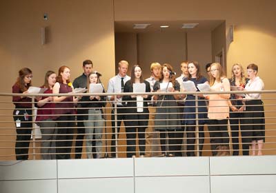 Students together on a balcony.