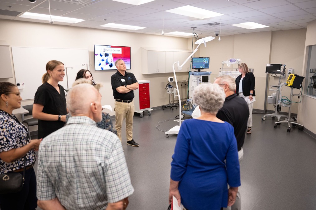 Visitors touring the Parry Center lab facilities.