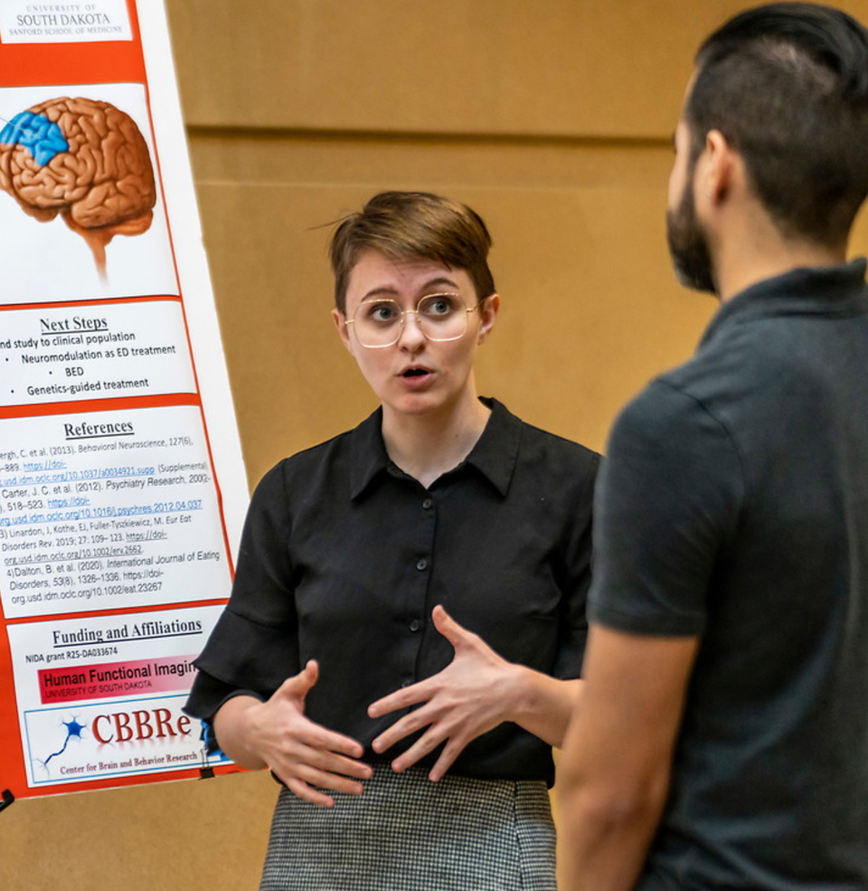 Two students in a conference.