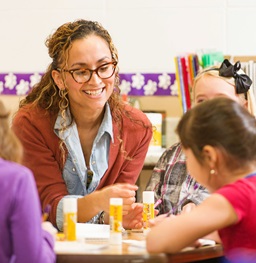 A teacher instructing children.