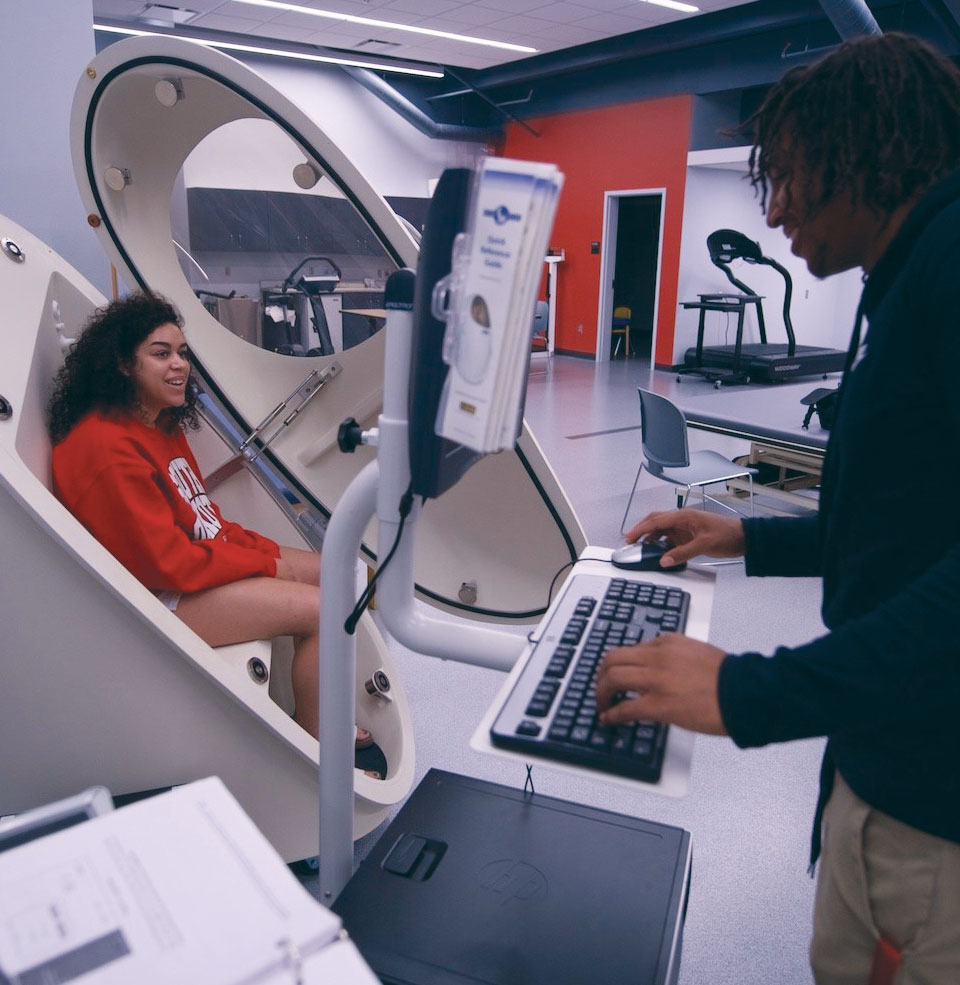 A student working at a computer station.