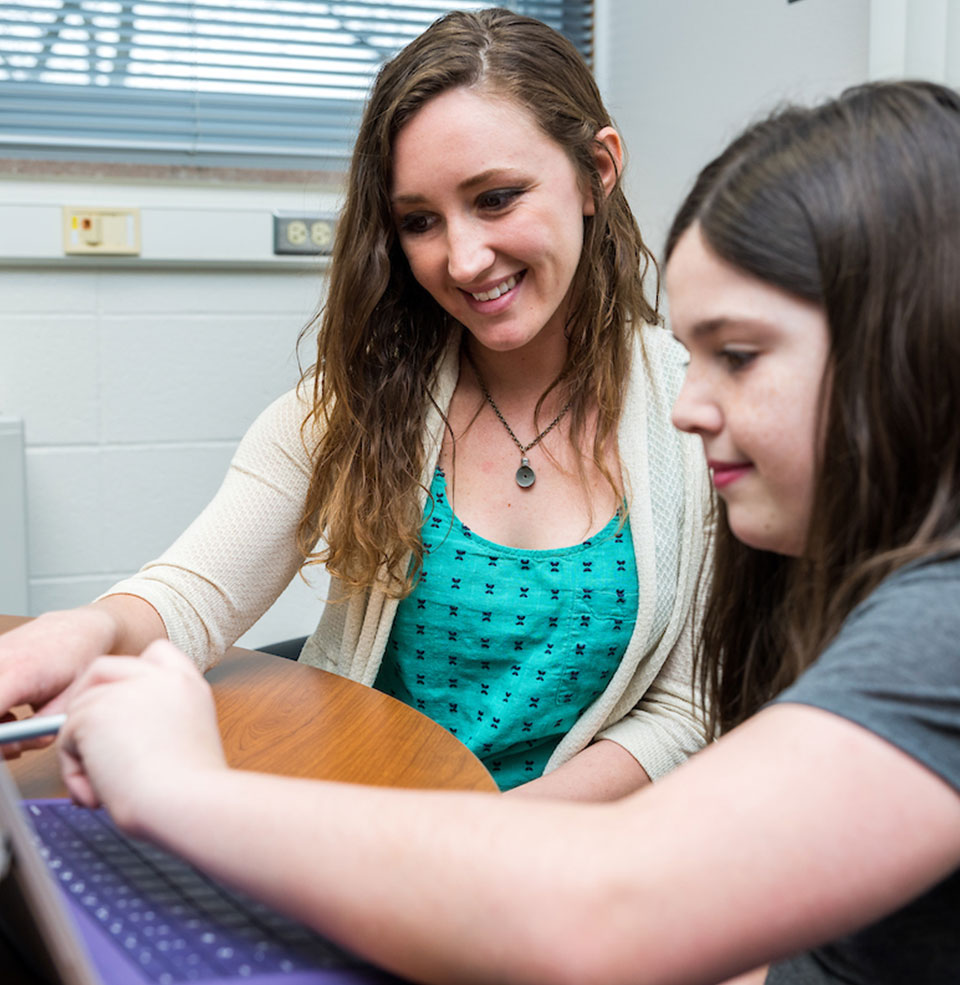 Two students doing hands-on work together.
