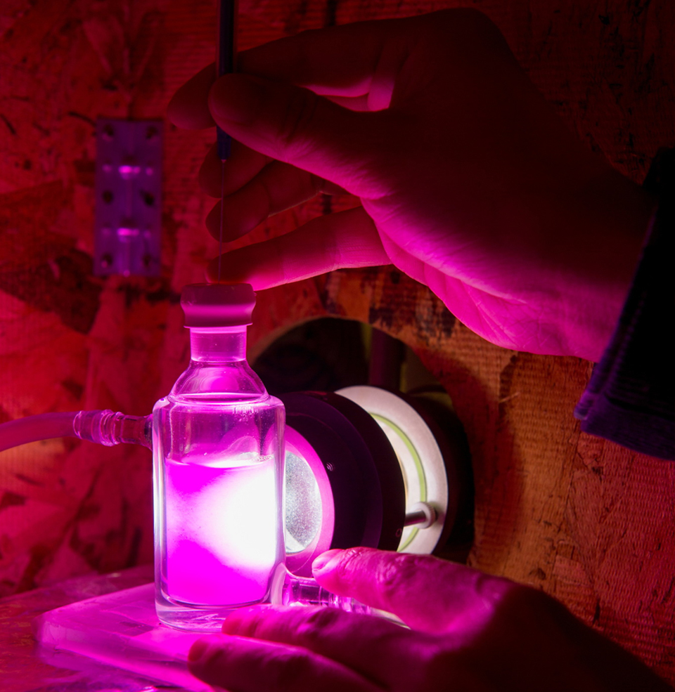 A vial of liquid in a lab.