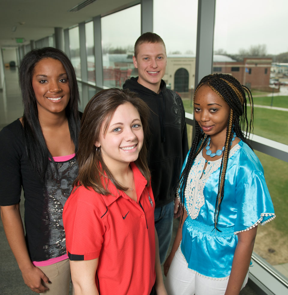 Public health students stand together smiling  in Beacom