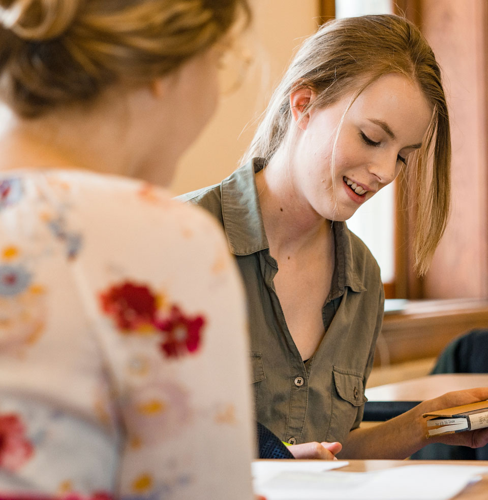 Students talking while studying.