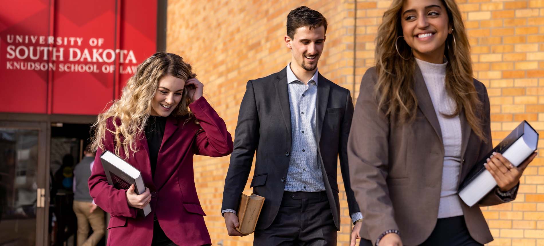 Students outside the Knudson School of Law building.