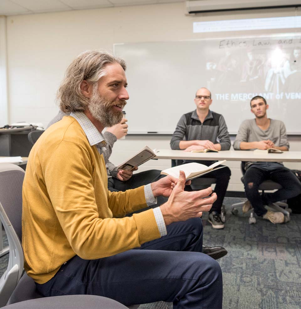 Professor Talking to a Group of Students