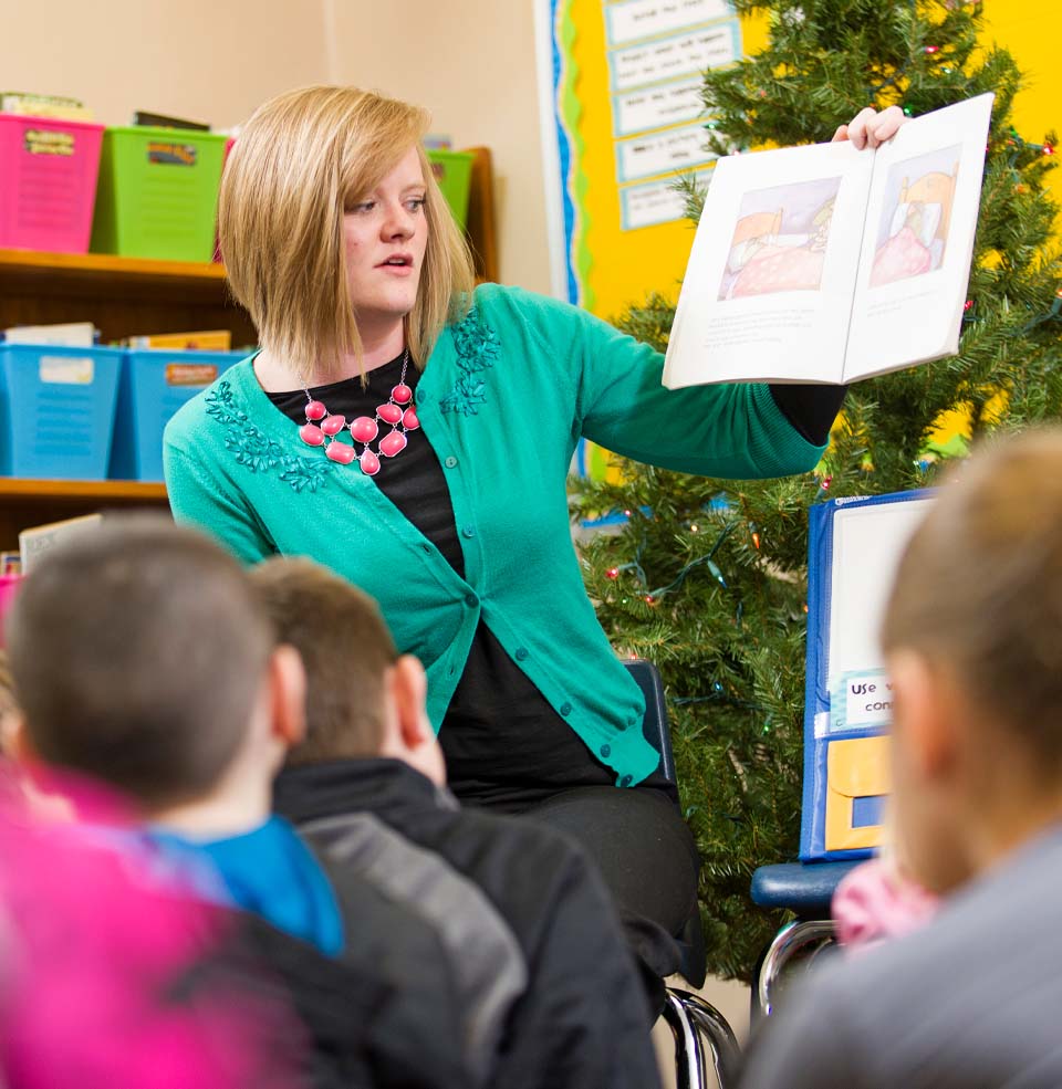 Teacher Reading a Story to an Elementary Class