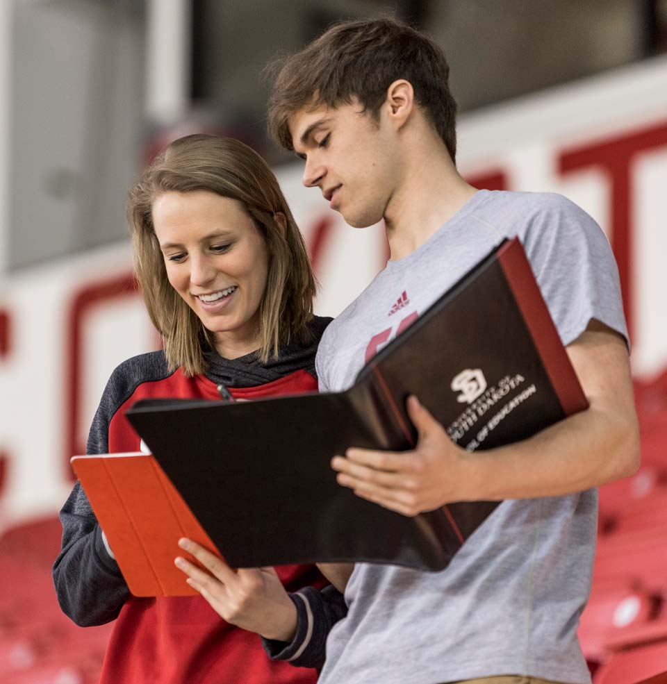 Two Students Planning an Event Inside the DakotaDome