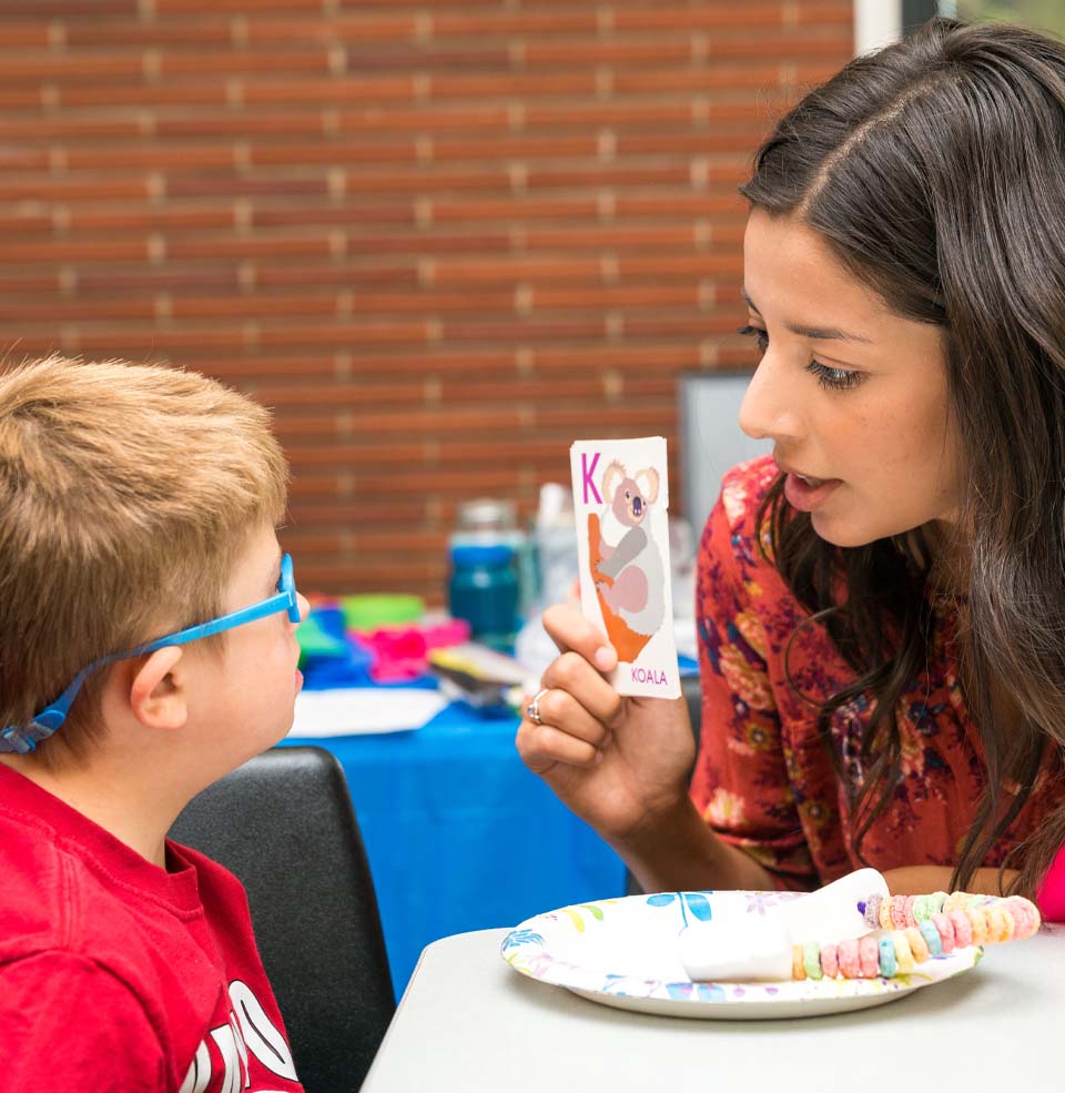 Special Education Teacher Working One-On-One with Student.