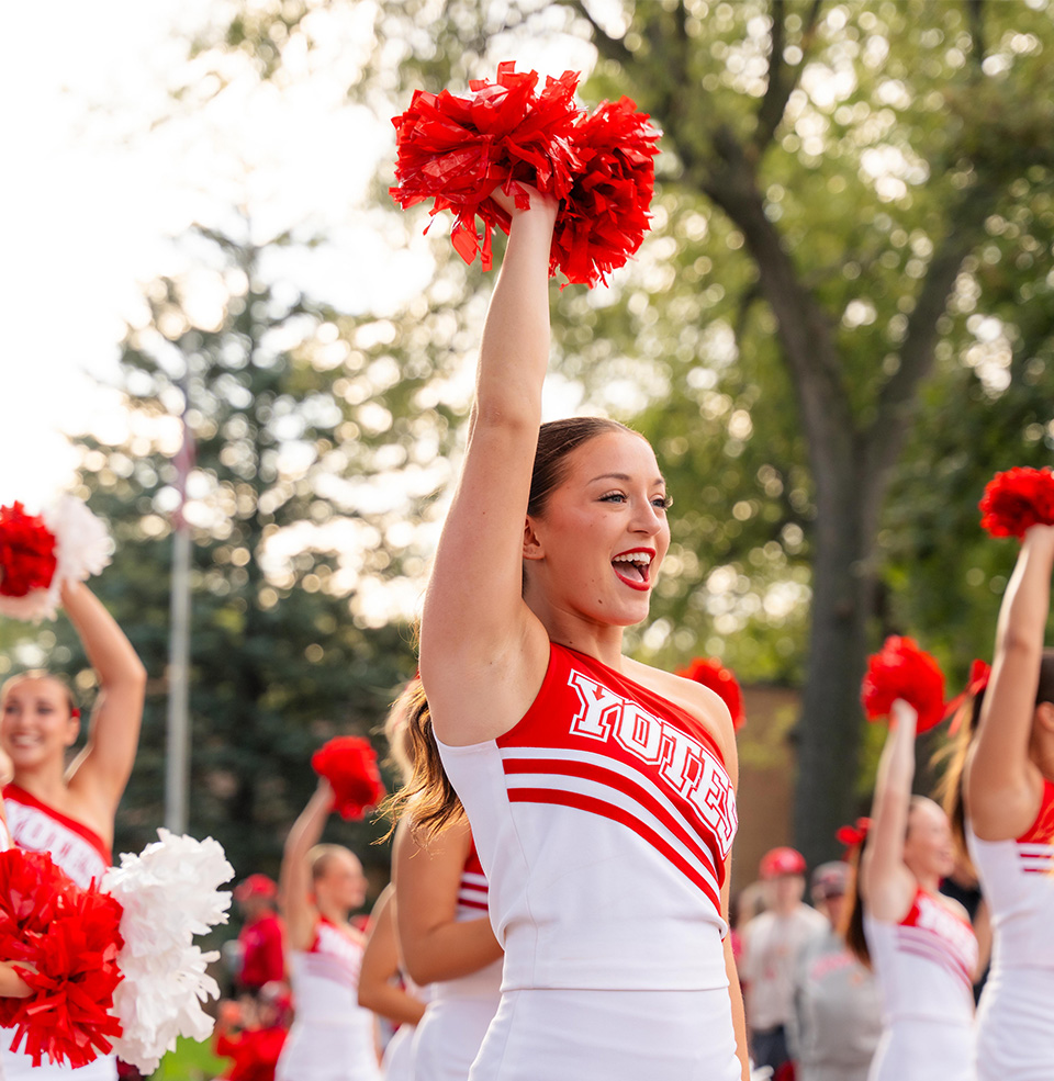 USD Cheerleader smiling in Dakota Days parade