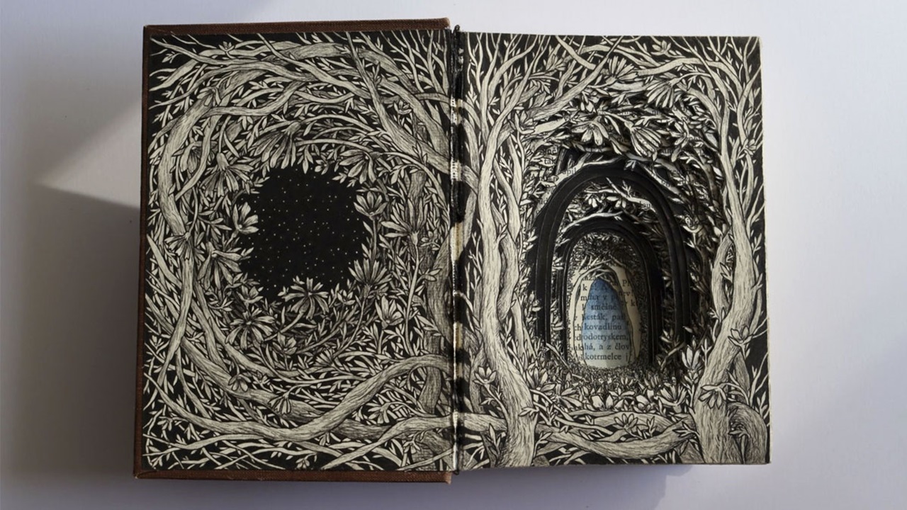 In Between, 2023, 11.5x16.5cm hardback novel, carved and illustrated with ink, colour pencil by Isobelle Ouzman In Between, 2023, 11.5x16.5cm hardback novel, carved and illustrated with ink, colour pencil by Isobelle Ouzman