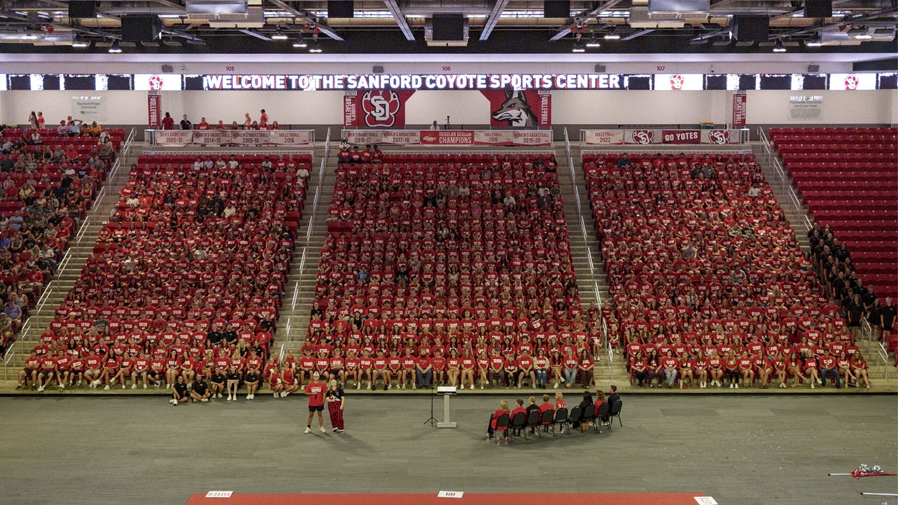 The USD Class of 2028 sitting together in the Sanford Coyote Sports Center. The USD Class of 2028 sitting together in the Sanford Coyote Sports Center.