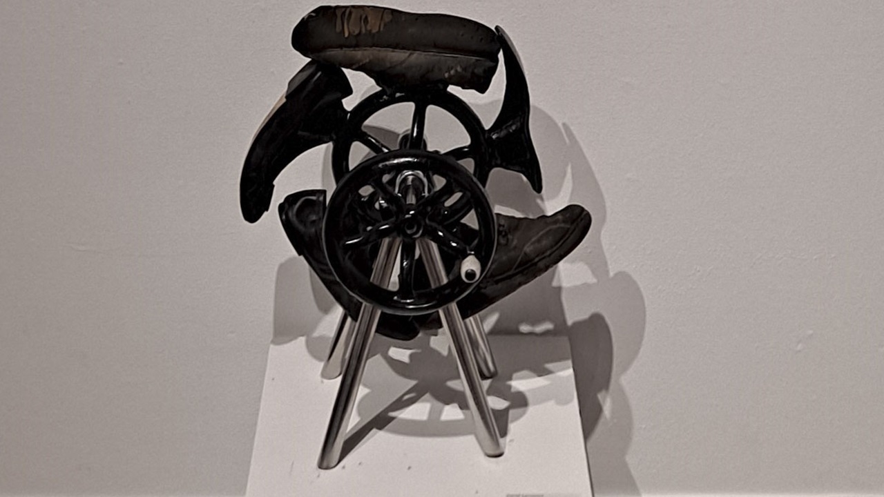 Sculpture student David Lammers' sculpture that incorporates shoe repair forms and old flywheel forms cast in iron Sculpture student David Lammers' sculpture that incorporates shoe repair forms and old flywheel forms cast in iron