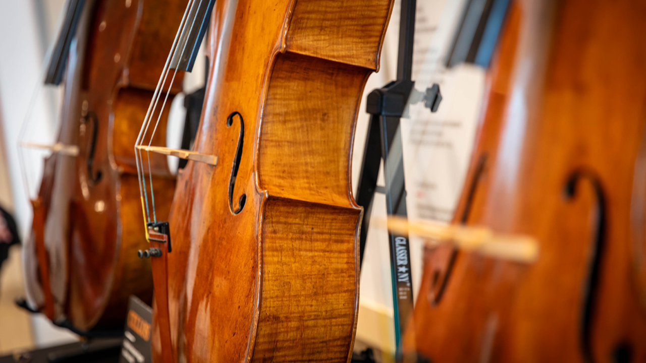 An up-close photo of three cellos.
