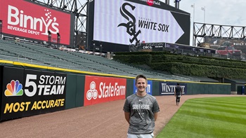 Aaron Trunt wearing a Chicago White Sox jersey on the White Sox field.