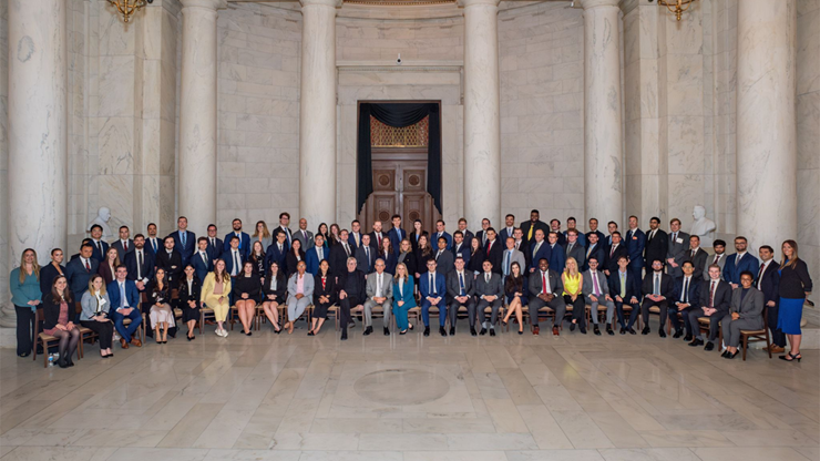Tory Shafer, J.D., a 2025 USD Knudson School of Law graduate, sits with the Originalism Summer Seminar at Georgetown University’s Center for the Constitution for a group photo.