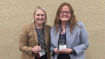 Teramie Hill ’09 J.D., and Renee Stellagher ’22  J.D., are pictured with their respective awards from the South Dakota State Bar.