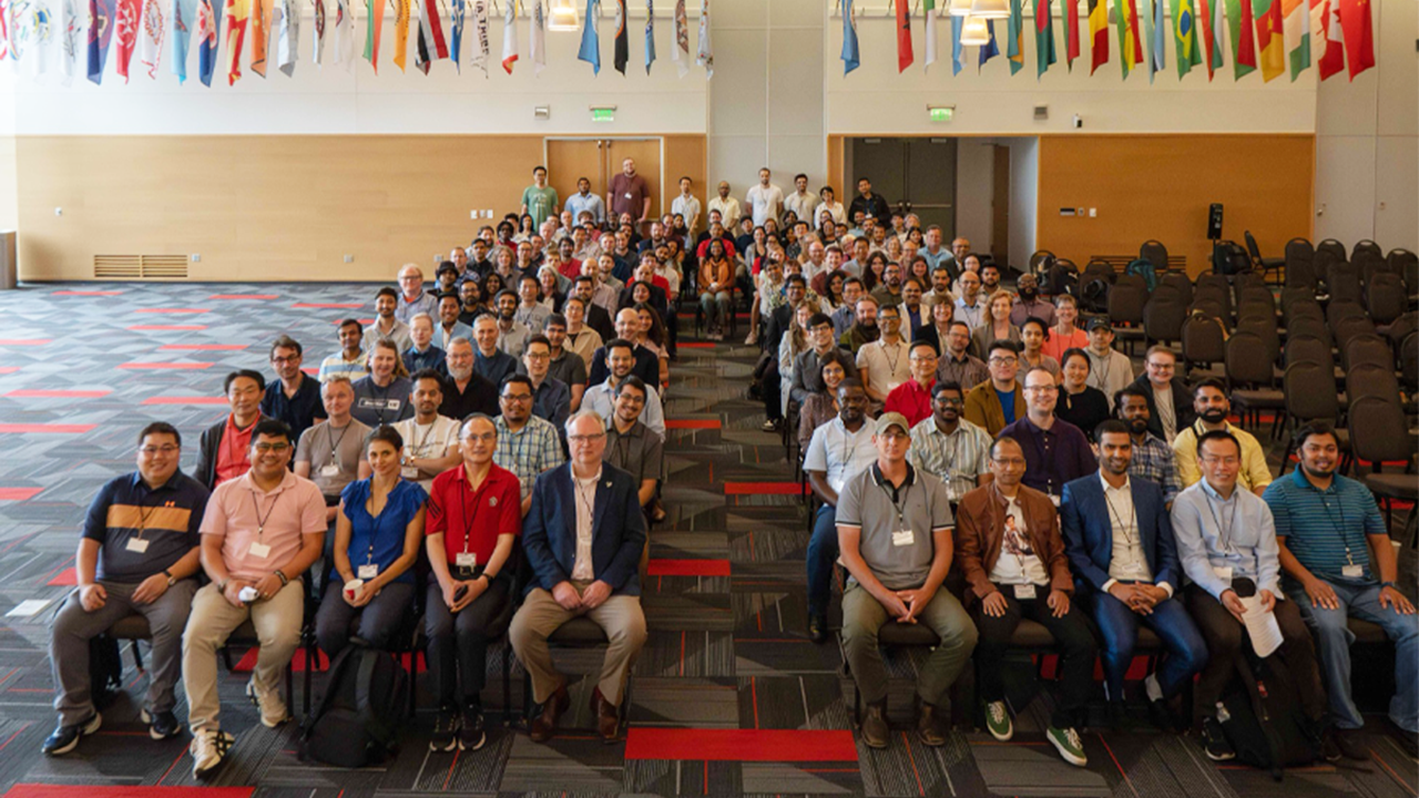 Participants sit in the MUC Ballroom and pose for a photo during the AI-Powered Materials Discovery Workshop.