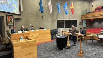 Students stand in the courtroom at the Knudson School of Law during the Intramural Trial competition.