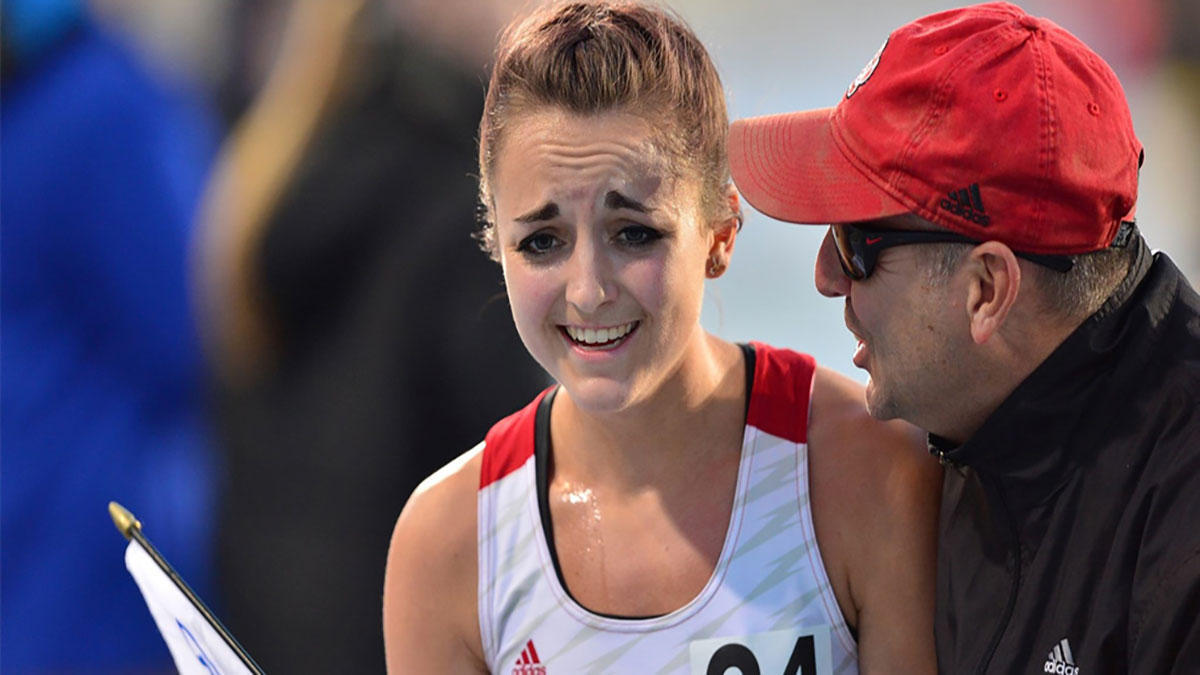Kelsey Barrett at the finish line with a big smile on her face.