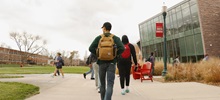 Students walking by the MUC during the day.