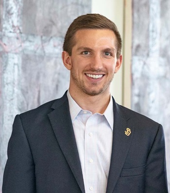 Success story Ben Cahoy smiling.