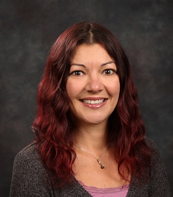 Success story Carrie Eckert smiling.