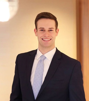 Success story Conrad Adam smiling.