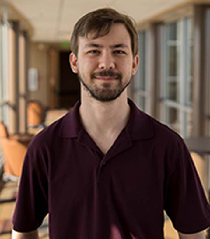 Success story Evan Sakry smiling.